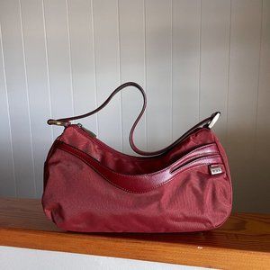 Small Red Tumi over shoulder purse with Red Leather straps and pink interior
